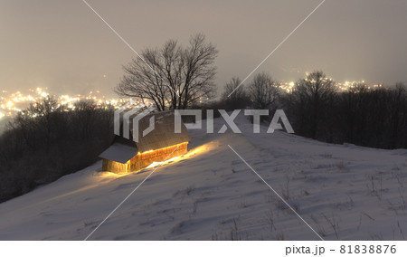 Fantastic winter landscape with glowing wooden house Fantastic winter landscape with glowing wooden house 81838876