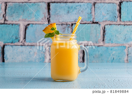 Tropical pineapple smoothie in a mason jar. Tropical pineapple smoothie in a mason jar. 81849884