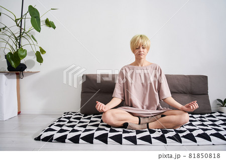 Woman in lotus pose with mudra gesture 81850818