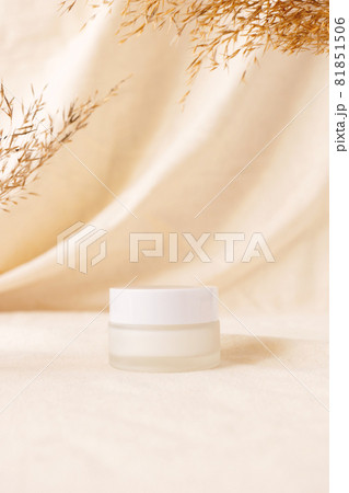 Cream beauty product mockup on linen drapery and dry branch of meadow plant. Concept eco organic cosmetic with natural extracts. Mock up skincare cosmetic product 81851506