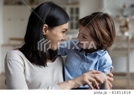 Happy asian young mother talking with adorable small kid son. Happy asian young mother talking with adorable small kid son. 81851818