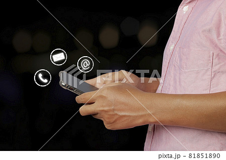 Young man using smartphone with icon phone, mail, and address. contact us. Young man using smartphone with icon phone, mail, and address. contact us. 81851890
