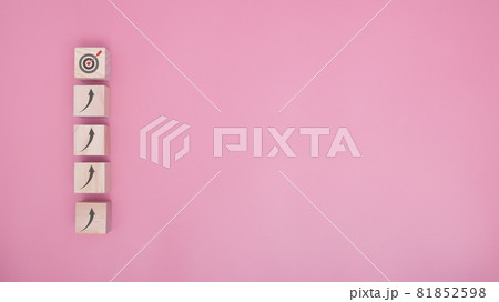 Arranging wood block stacking as step stair go to target on pink background, Business concept growth success process. copy space. 81852598