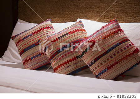 Comfortable pillows on bed in the bedroom. 81853205