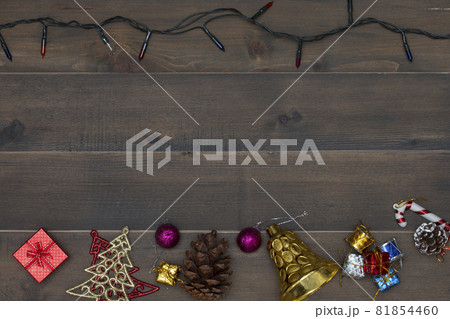 Christmas background - vintage planked wood with christmas decoration and free text space Christmas background - vintage planked wood with christmas decoration and free text space 81854460