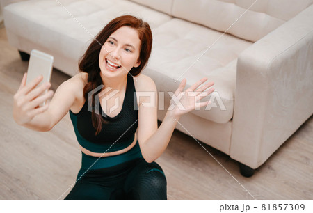 Young athlete coach is welcomed by fitness students online. Young athlete coach is welcomed by fitness students online. 81857309