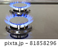 Modern kitchen stove cook with blue flames burning. 81858296
