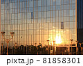Clouds and sunset reflection in glass office building. 81858301