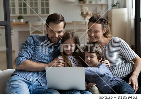 Happy couple of parents and children resting on sofa 81859463