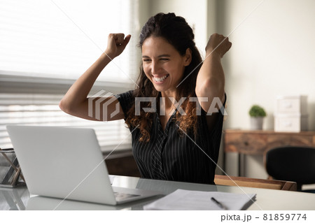 Happy excited millennial businesswoman in casual excited with good news Happy excited millennial businesswoman in casual excited with good news 81859774