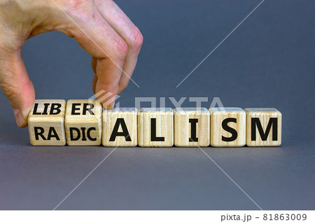 Radicalism or liberalism symbol. Male hand turns cubes and changes the word 'radicalism' to 'liberalism'. Beautiful grey background. Business and radicalism or liberalism concept. Copy space. Radicalism or liberalism symbol. Male hand turns cubes and changes the word 'radicalism' to 'liberalism'. Beautiful grey background. Business and radicalism or liberalism concept. Copy space. 81863009