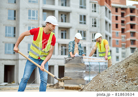 Hardworking Caucasian male builder working on the construction site Hardworking Caucasian male builder working on the construction site 81863634