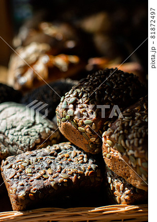Rye bread with seeds in a basket Rye bread with seeds in a basket 81872497
