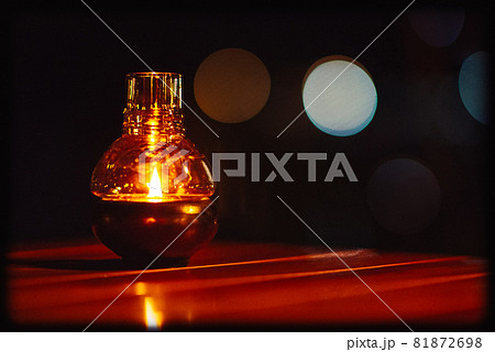 Alcohol lamps on the table in the dark night with bokeh effect Alcohol lamps on the table in the dark night with bokeh effect 81872698