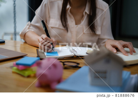 Business woman or broker checking contract agreement paper with customer to sign contract. Real Estate and Agreement concept Business woman or broker checking contract agreement paper with customer to sign contract. Real Estate and Agreement concept 81888676
