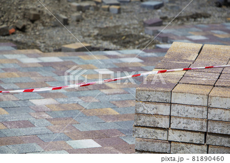 Process of construction of brick paved sidewalk, half built pavement road 81890460