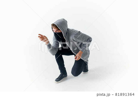 a man in a mask with a hood on his head thief hacking a man in a mask with a hood on his head thief hacking 81891364