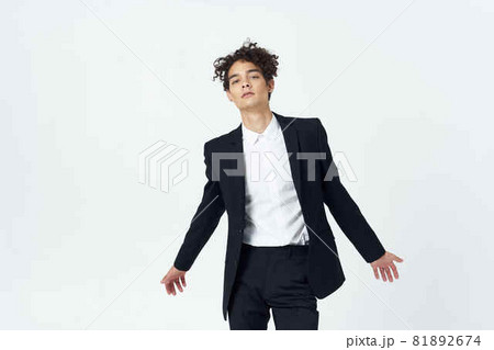 guy in a suit curly hair fashion self-confidence official 81892674