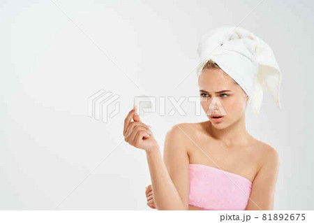 pretty woman with towel on head health clean skin dermatology cleaning 81892675