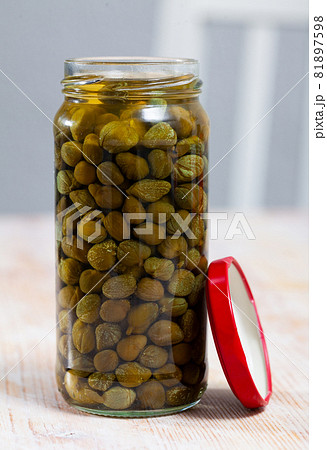 Pickled capers in glass jar Pickled capers in glass jar 81897598