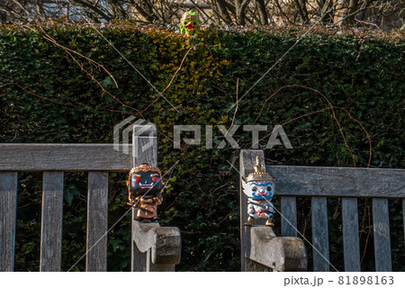 Ravana and Giantess and Hanuman Sitting on the backrest of the wooden chair. Ravana and Giantess and Hanuman Sitting on the backrest of the wooden chair. 81898163