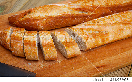Baguette on wooden surface 81898963