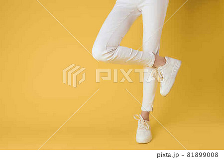 womens sneakers posing modern style yellow background 81899008