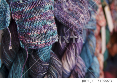 Colored cotton yarn for knitting. Hand-dyed threads. Modern tie dye on the thread skein Colored cotton yarn for knitting. Hand-dyed threads. Modern tie dye on the thread skein 81900731