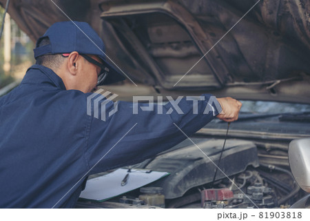 Mechanic car service auto garage in automotive mobile center. Technician workshop repair engine motor vehicles service mechanical engineering business. Automobile mechanic hands car repairs technic 81903818