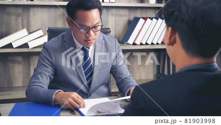 Job HR applicants having an interview with Human resource manager jobs interviewing with confident candidate at business firm office give cv resume. Job Interview with headhunter agent and applicant 81903998