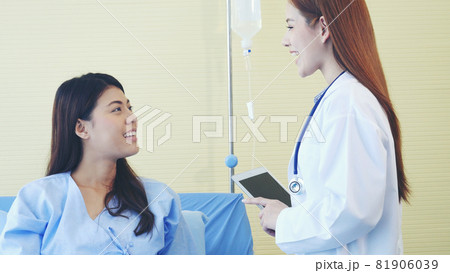 Woman doctor and patient consultation with professional specialist diagnostics at hospital medicare treatment clinic. Doctor talking to patient for medical health care therapy. Healthy medical concept Woman doctor and patient consultation with professional specialist diagnostics at hospital medicare treatment clinic. Doctor talking to patient for medical health care therapy. Healthy medical concept 81906039