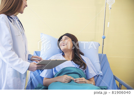 Woman doctor and patient consultation with professional specialist diagnostics at hospital medicare treatment clinic. Doctor talking to patient for medical health care therapy. Healthy medical concept Woman doctor and patient consultation with professional specialist diagnostics at hospital medicare treatment clinic. Doctor talking to patient for medical health care therapy. Healthy medical concept 81906040