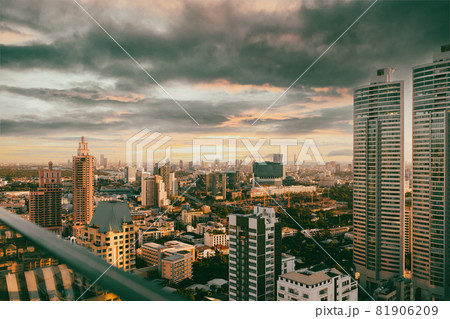 Skyscrapers and beautiful cloud in sunset time at rooftop building in the metropolis, horizontal view. Skyscrapers and beautiful cloud in sunset time at rooftop building in the metropolis, horizontal view. 81906209