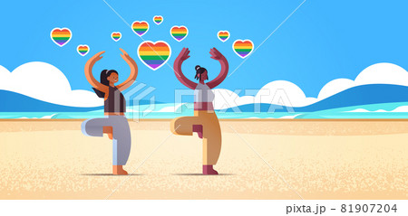 mix race girls lovers doing physical exercises beach lesbian love parade transgender LGBT concept 81907204