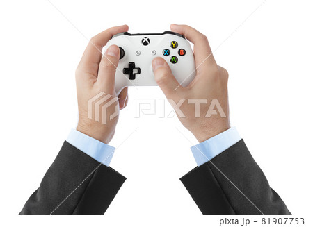 Moscow, Russia - April 18, 2019: Hands and wireless Xbox console gamepad - isolated on white background 81907753
