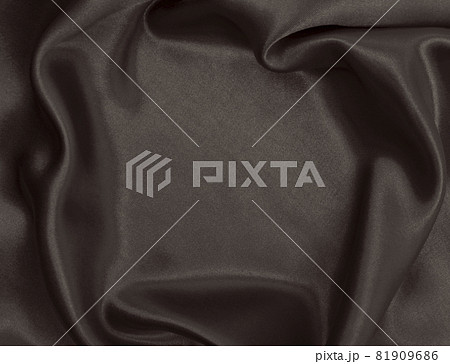Smooth elegant brown silk or satin luxury cloth texture as abstract background. Luxurious background design wallpaper. In Sepia toned. Retro style Smooth elegant brown silk or satin luxury cloth texture as abstract background. Luxurious background design wallpaper. In Sepia toned. Retro style 81909686