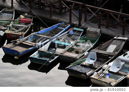 Colored fishing boats on the water. 81910002