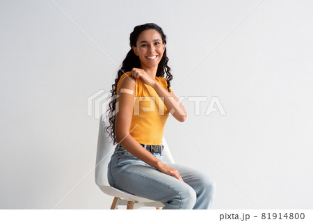 Vaccination Campaign Ad. Happy Young Lady Showing Arm After Coronavirus Vaccine Injection Vaccination Campaign Ad. Happy Young Lady Showing Arm After Coronavirus Vaccine Injection 81914800