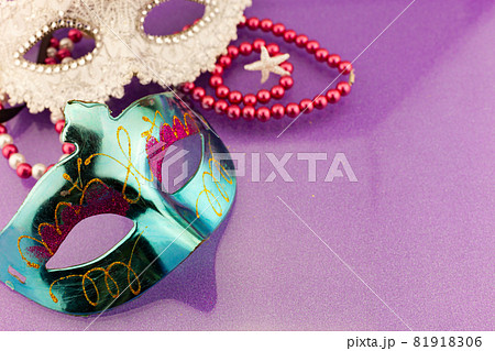 A festive,Beautiful mardi gras or carnival mask on beautiful colorful paper background 81918306