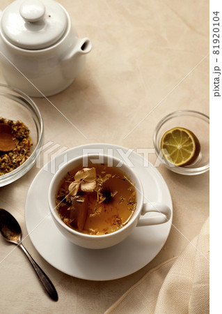 Cup of tea. Warm delicious cup of refreshing herbal tea. 81920104