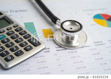 Stethoscope with calculator on chart graph paper, finance, account, statistic, analytic economy Business concept. Stethoscope with calculator on chart graph paper, finance, account, statistic, analytic economy Business concept. 81920228