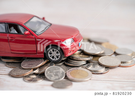 Car on coins background; Car loan, Finance, saving money, insurance and leasing time concepts. 81920230