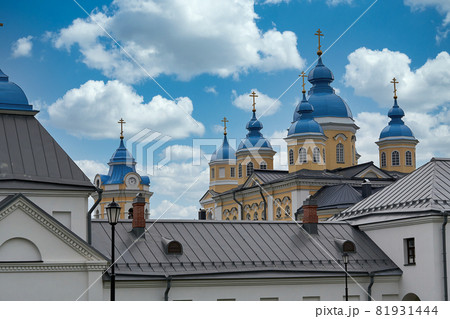 Fragment of the bell tower of a Christian church with a blue roof Fragment of the bell tower of a Christian church with a blue roof 81931444