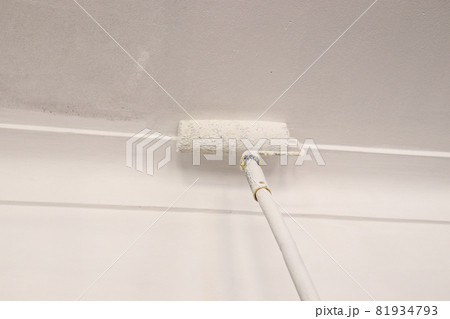paint brush with plastic paint on the ceiling for painting 81934793