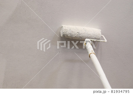 paint brush with plastic paint on the ceiling for painting 81934795