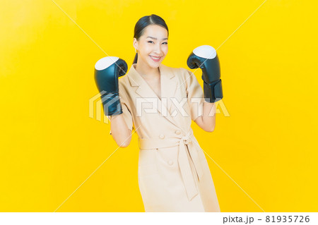 Portrait beautiful young asian woman with boxing glove Portrait beautiful young asian woman with boxing glove 81935726