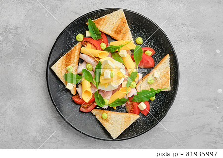 Top view of pieces of toast, ham, boiled egg, cheddar and tomato Top view of pieces of toast, ham, boiled egg, cheddar and tomato 81935997