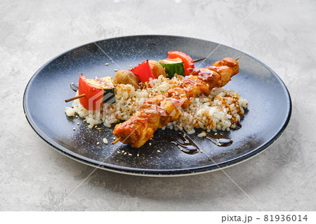 Shashlik with chicken and grilled champignon with bell pepper and zucchini Shashlik with chicken and grilled champignon with bell pepper and zucchini 81936014