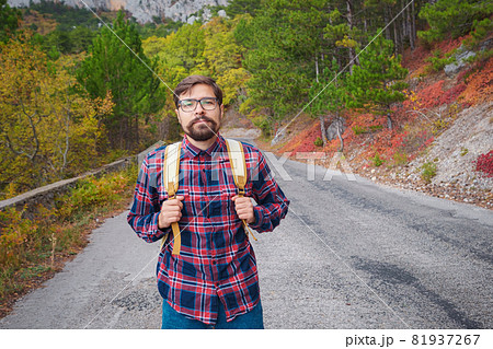 Travel man with backpack hiking in the mountains 81937267