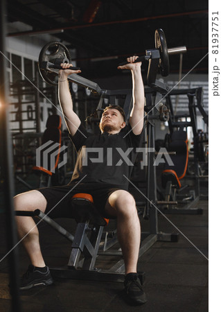 A handsome man is engaged in a gym A handsome man is engaged in a gym 81937751